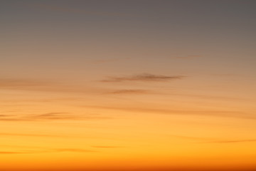 Orange horizon and blue atmosphere. Smooth orange blue gradient of dawn sky.