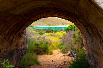 bridge and tunnel made by man in natural setting of the canary islands