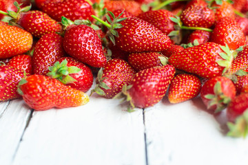 Fresh, red strawberries on old white table