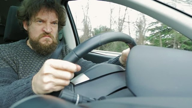 Angry man driving car screaming after loosing job because of coronavirus financial crisis