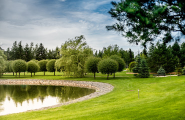 beautiful landscape Park with a small pond on a Sunny day