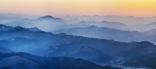 Fototapeta na wymiar silhouettes of mountains. foggy autumn morning. Morning Carpathians