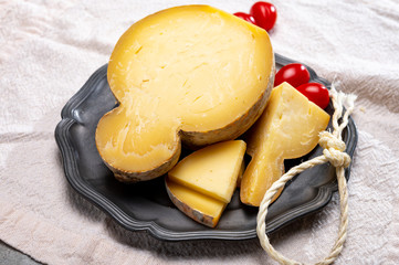 Italian semi hard matured caciocavallo cheese, handmade and aged in natural underground caves in Apulia region