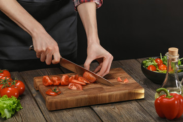 Woman cooking fresh vegetable salad. Female hands. Diet concept for healthy lifestyle with copyspace.