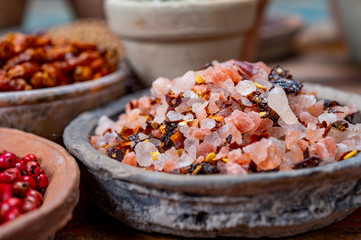Indian spices collection, sea and rock salt mixed with red hot chili peppers and another spices in clay bowls