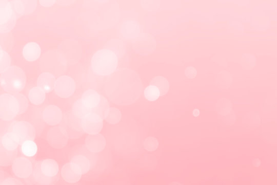 white bokeh defocus glitter blur on pink background.