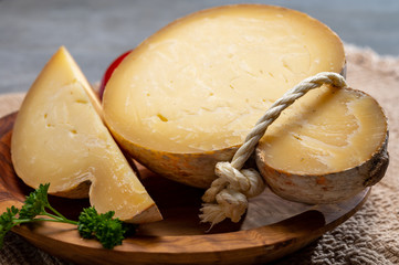 Italian semi hard matured caciocavallo cheese, handmade and aged in natural underground caves in...