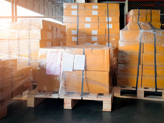 stack package boxes wrapping plastic on pallets, Interior of warehouse storage, warehouse industry...