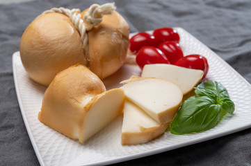 Italian semi hard handmade smoked scamorza cheese, from cow milk from Apulia or Calabria regions