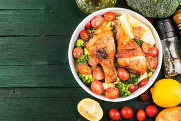 Grilled chicken leg with boiled potatoes and vegetable