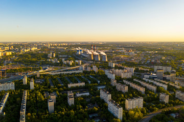 urban landscapes with houses and parks at sunset filmed from a drone