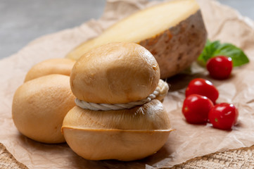 Italian semi hard handmade smoked scamorza and caciocavallo matured in caves cheeses made from cow milk from Apulia or Calabria regions