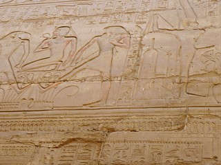 Ancient hieroglyphs on wall, at Karnak temple in Luxor, Egypt.