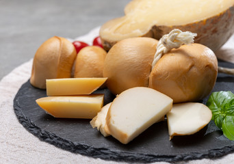 Italian semi hard handmade smoked scamorza and caciocavallo matured in caves cheeses made from cow milk from Apulia or Calabria regions