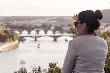 Beautiful woman viewing Danube River on lockout, Prague