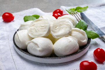 Tasty italian food, fresh white buffalo mozzarella soft cheese balls from Campania