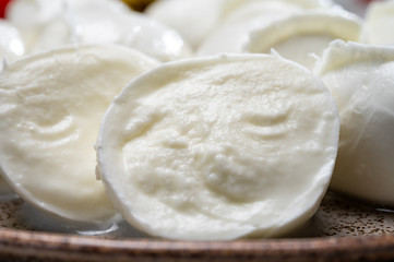 Tasty italian food, fresh white buffalo mozzarella soft cheese balls from Campania