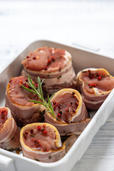 pork tenderloin in bacon on pepper