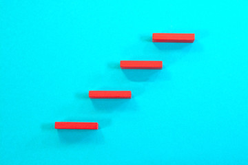 Steps to success. Red steps on blue background.