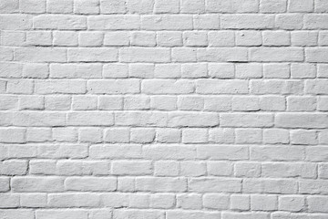 Old whitewashed and painted white wall, background and texture