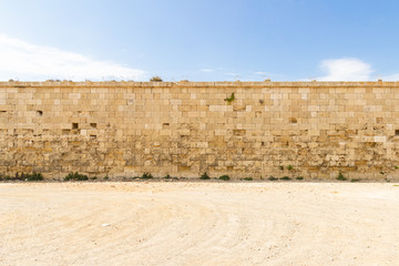 Nice old stone wall in a desert landscape on a sunny day in Menorca. Obstacle or challenge concept....