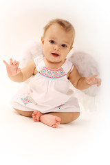Little baby girl angel on a white background