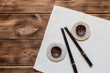 Accessories for sushi on a wooden table. Close up. Selective focus.