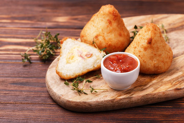 sicilian arancini di riso. risotto rice balls. Coxinha of chicken, Brazilian