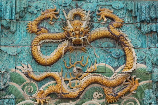 chinese dragon statue on wall