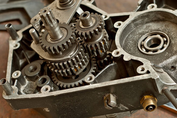 Disassembled engine from a motorcycle close up. Repair and maintenance of old spare parts.