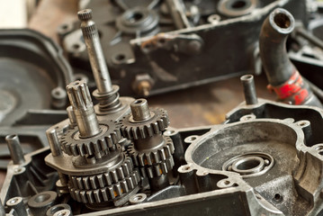 Disassembled engine from a motorcycle close up. Repair and maintenance of old spare parts.