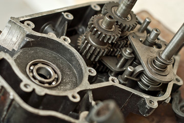 Disassembled engine from a motorcycle close up. Repair and maintenance of old spare parts.