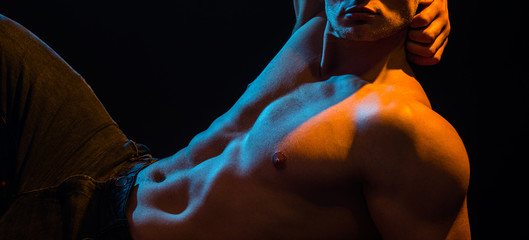 Gay sexy. Athletic Man fitness model with strong torso showing six pack abs. Fitness abdominal...