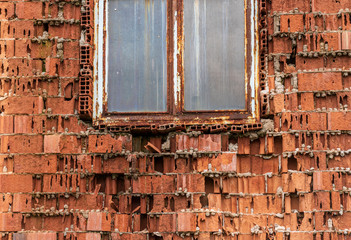 Old factory window with broken glass 