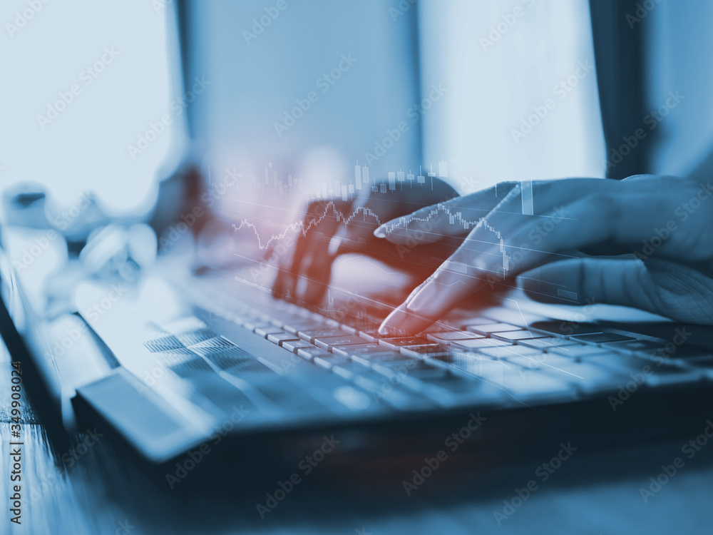 Poster close up of hand typping on keyboard of computer laptop with business graph, in concept of business 