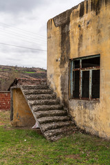 Fototapeta na wymiar Abandoned building, stairway to the roof