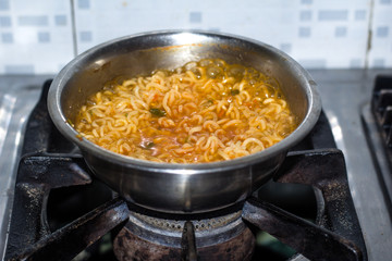 Cook Famous home made asian instant noodle in a porcelain bowl . Close up