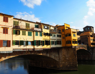 Fototapeta na wymiar View of the Ponte Vecchio bridge. It is a medieval bridge over the Arno River, in Florence, Italy.