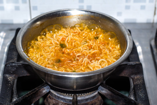 Cook Famous home made asian instant noodle in a porcelain bowl . Close up
