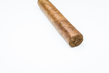 Good thick cigar from twisted sheets on white background.
