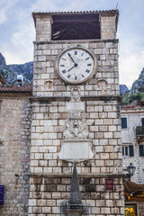 Fototapeta na wymiar 17th century Clock Tower on Arms Square - main square of historic part of Kotor city, Montenegro