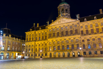 Dam square at night in Amsterdam, Holland.