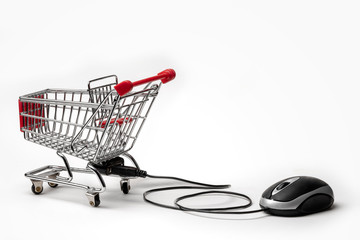 Computer mouse, connected to a shopping cart. Internet shopping concept
