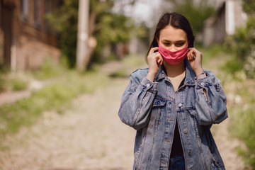 Woman wears a mask due to air pollution or a virus outbreak in the city