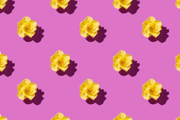 repeating collage of yellow flowers on purple background, nature background. season minimal pattern, minimal summer concept