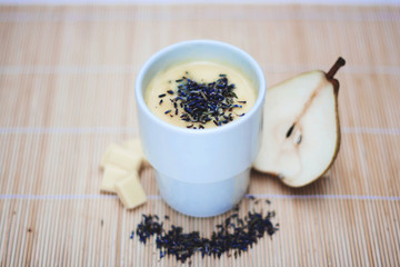 White drinking chocolate with pear and  lavender flovers