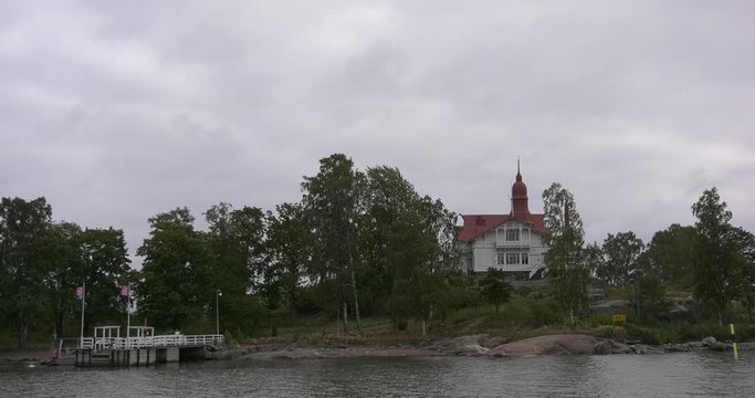 4K Helsinki Baltic Sea Finnish Bay lagoon, yachts, cruise liners view on bright summer day aerial video, Luoto Island green park, old beautiful red roof mansion in Finland capital Suomi, north Europe
