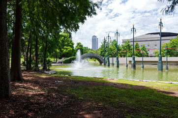 new orleans park and pond with fountain and bridge