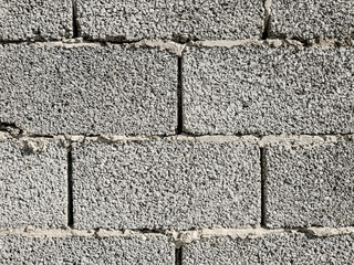 Concrete Cement Block bricks in stack for wall construction. Dirty Old Texture.