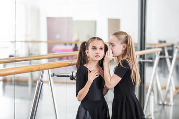 Small beautiful cute girls children in the Studio train at a dance lesson.